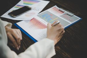 Business woman working with analysis marketing document .