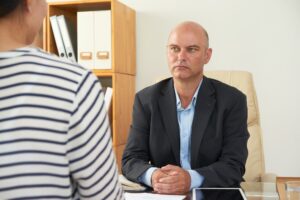 Consultant working with client at office